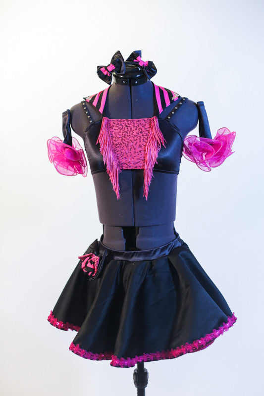 Black half-top has pink sequin insert, fringe & halter style striped collar. Has a black skirt, with pink petticoat & panty.Comes with  gauntlets & hair piece. Front
