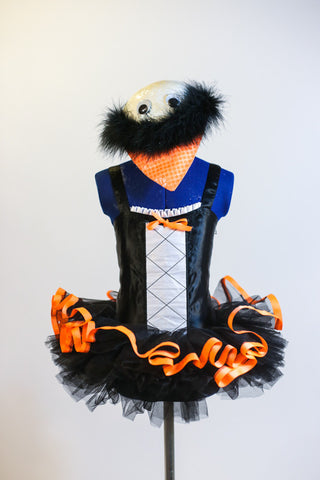 Black penguin leotard with white front & orange bow has pull-on black tutu with orange trim &white shiny hat with black marabou trim, beak & googly eyes. Front