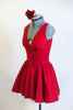 Deep red, halter leotard dress has cross straps, low back, wide waistband, triangle style bust area and gathered skirt. Comes with matching floral hair piece. Side